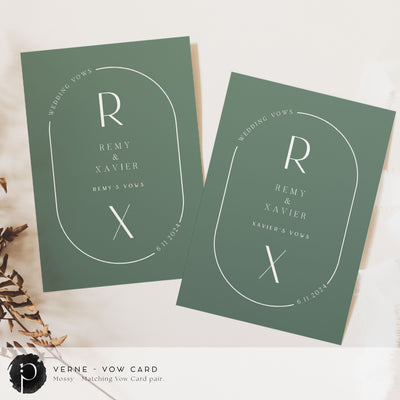 A pair of vow cards to write your wedding vows on in a modern midcentury wedding theme with dark sage green background with white writing