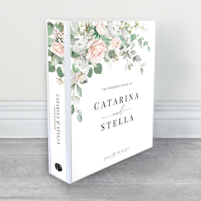 A wedding planner, guide and organiser with nude and white roses and anemone flowers and soft grey green eucalyptus leaves