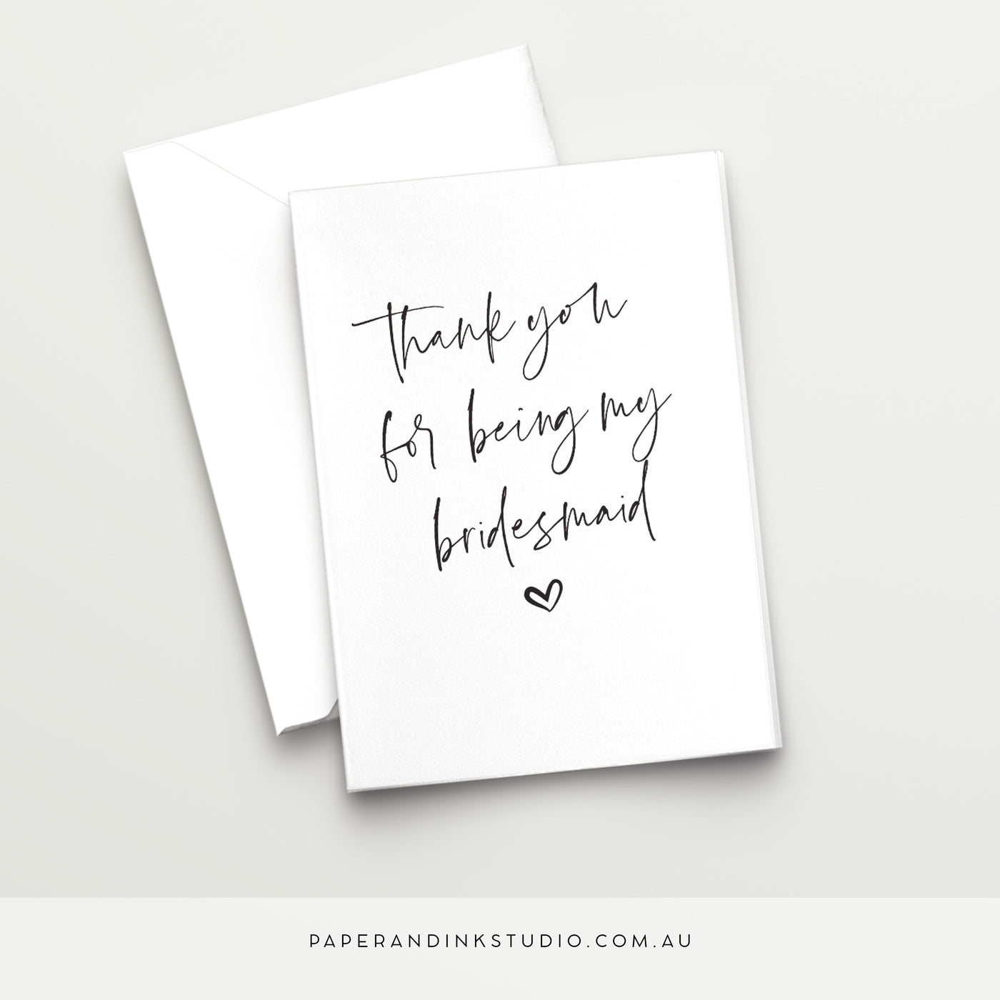 A white folded wedding card in a design called Thorne with black writing that says thank you for being my bridesmaid, to give to your bridesmaid on or after your wedding day.