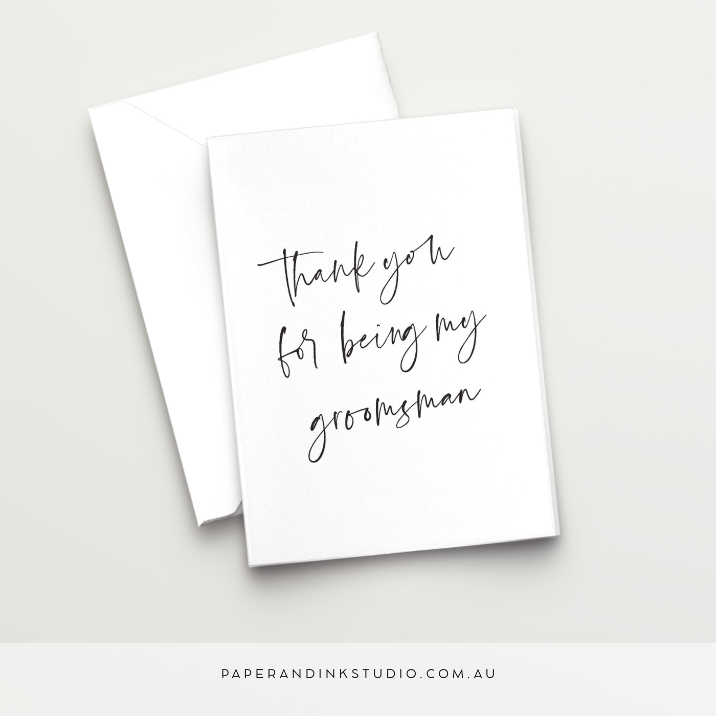 A white folded wedding card in a design called Thorne with black writing that says thank you for being my groomsman, to give to your groomsman on or after your wedding day.