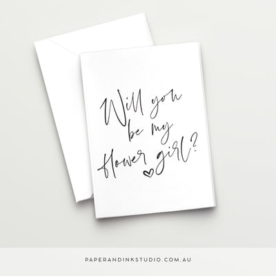 A white folded wedding or best woman card in a design called Thorne with black writing that says will you be my flower girl, asking your niece, child, godchild or friend's child to be your flower girl at your wedding.