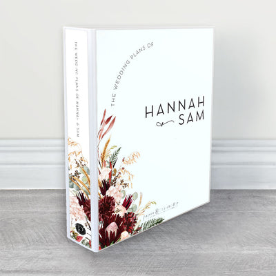 A wedding planner, guide and organiser in a modern floral design with burgundy and ivory australian native flowers, golden wheat and green ferns